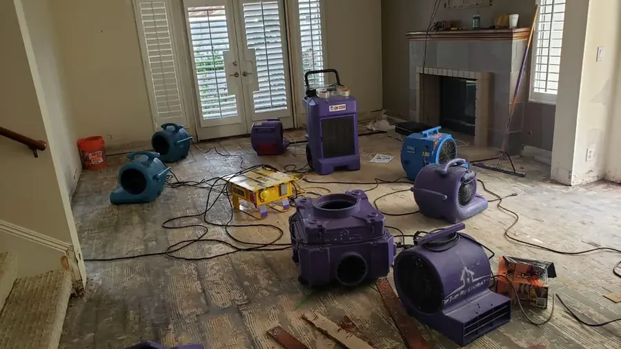 Drying equipment set in a damaged living room in a San Marino, CA home