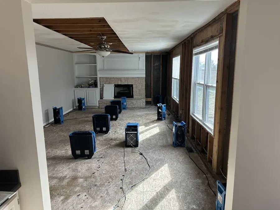 Air movers drying a room down to the studs in a San Marino, CA home
