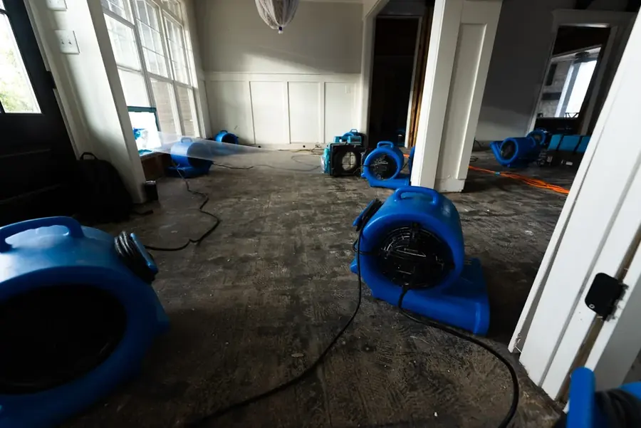 Drying equipment saving original hardwood after water damage in a San Marino home